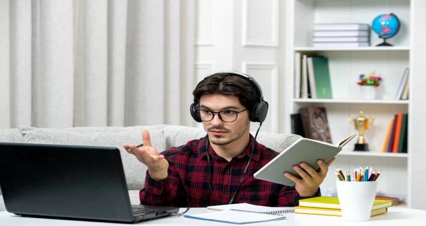 student-online-cute-guy-checked-shirt-with-glasses-studying-computer-waving-hands